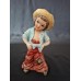 Vintage figurine titled "The Little Tramp"