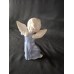 Vintage Porcelain Figurine of a Kneeling Angel Playing a Musical Instrument
