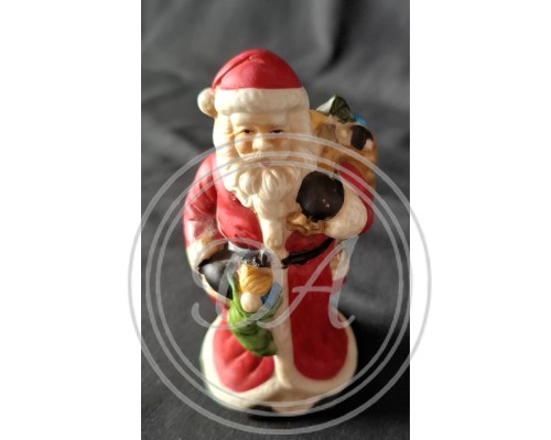 Vintage Ceramic Santa Claus Figurine. This is a hand-painted decorative item.