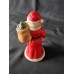 Vintage Ceramic Santa Claus Figurine. This is a hand-painted decorative item.