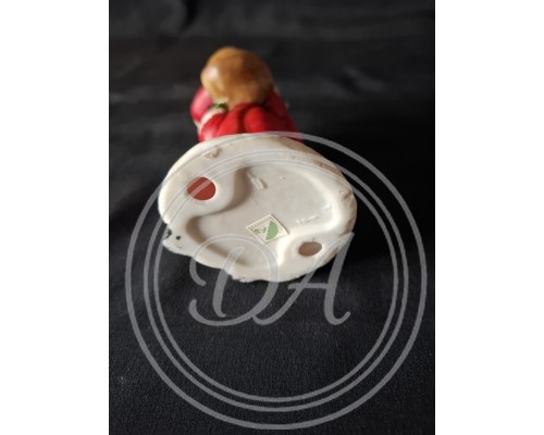 Vintage Ceramic Santa Claus Figurine. This is a hand-painted decorative item.