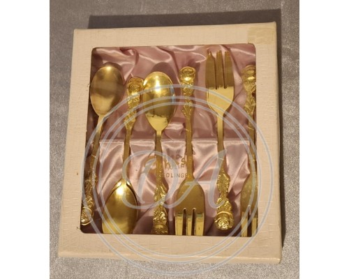 An antique set of gilded coffee spoons and forks, made in Solingen