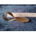 A collector's spoon with an unusually curved handle.