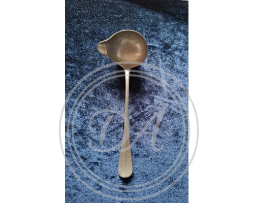 Antique metal stamp spoon.