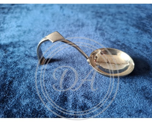 Antique silver ladle or sauce ladle.