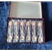 A set of 6 silver-plated teaspoons with a pink porcelain cameo flower inlay on the handle.