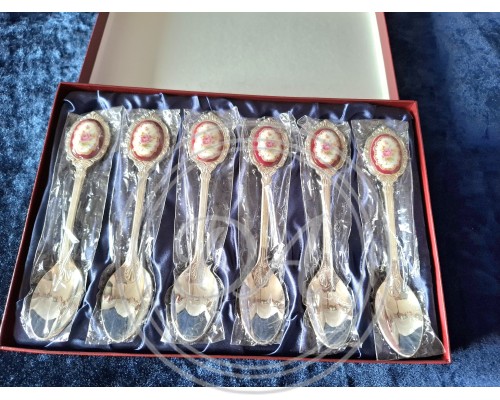 A set of 6 silver-plated teaspoons with a pink porcelain cameo flower inlay on the handle.