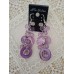 Purple drop earrings with crystals and mother-of-pearl or shell elements.