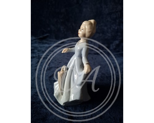 Vintage porcelain figurine "Girl with Umbrella" from Germany.