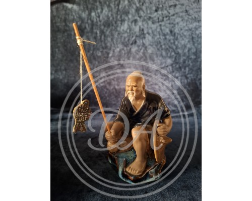 A Chinese fisherman figurine in the Shiwan style, Shiwan "Mud Man", 1950 s