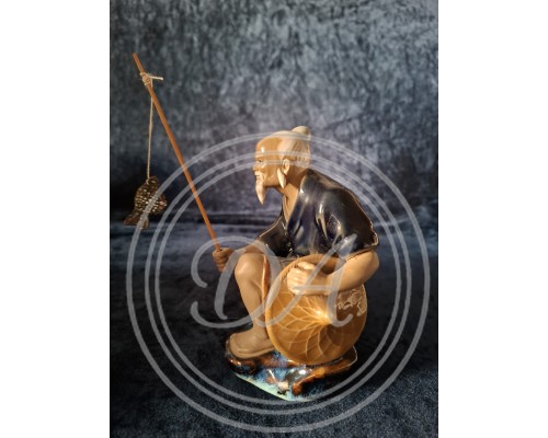 A Chinese fisherman figurine in the Shiwan style, Shiwan "Mud Man", 1950 s