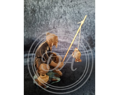 A Chinese fisherman figurine in the Shiwan style, Shiwan "Mud Man", 1950 s