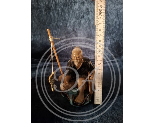 A Chinese fisherman figurine in the Shiwan style, Shiwan "Mud Man", 1950 s