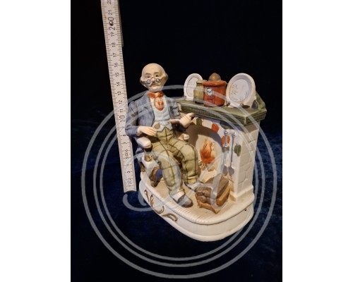 Porcelain figurine "Man Reading in Front of a Fireplace", Italy