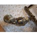 Antik Hand-made brass bell panel with a bird motif.