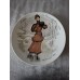 A set of 12 collector plates, “Women of the Century”, Limoges, France.