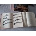 Two volumes of Yaroslav Lugs's books, "Handheld Firearms and Their History"