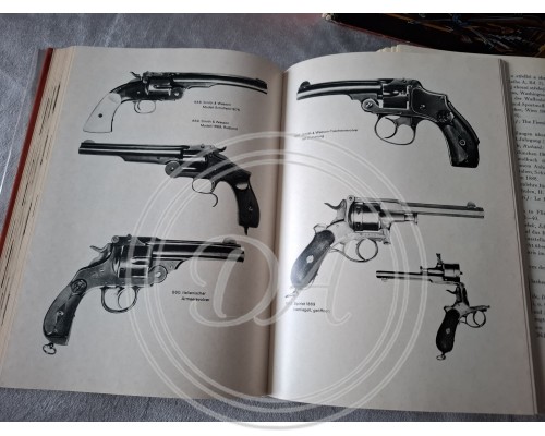 Two volumes of Yaroslav Lugs's books, "Handheld Firearms and Their History"