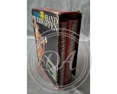 Two volumes of Yaroslav Lugs's books, "Handheld Firearms and Their History"